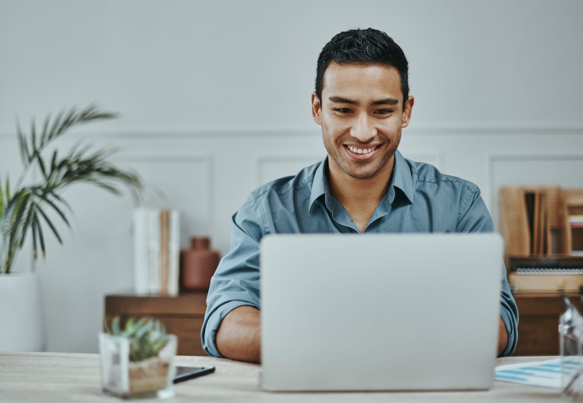 man sitting behind computer