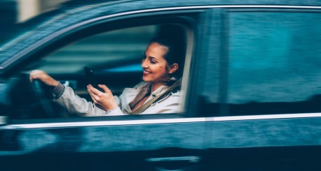woman texting while driving
