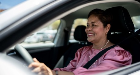 older hispanic woman driving car