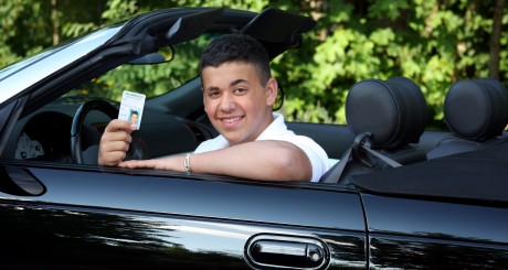 hispanic male in a car