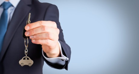 man holding car keys