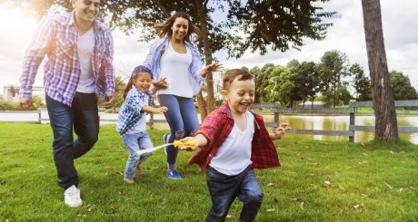family playing outside in the summer