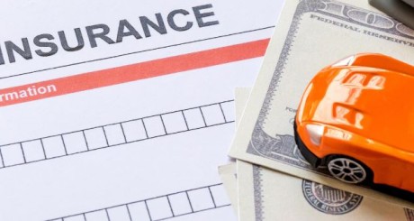 toy car on top of insurance paperwork