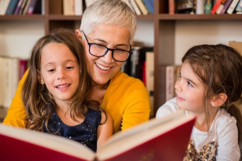 grandma reading with grandchildren
